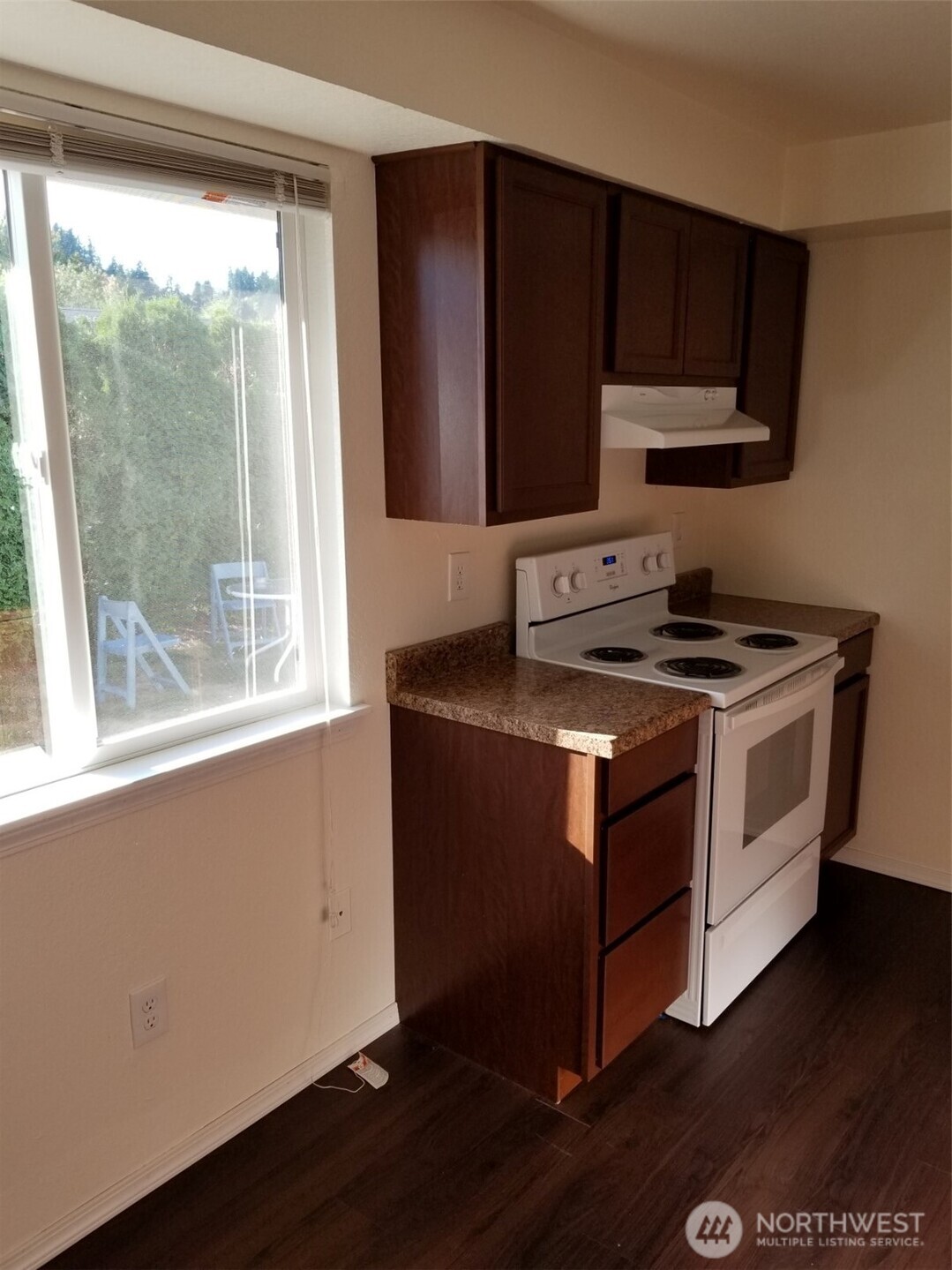 218 3rd Avenue Southwest Pacific, WA 98047 - Photo 15 of 16 a kitchen with granite countertop wooden cabinets and a stove