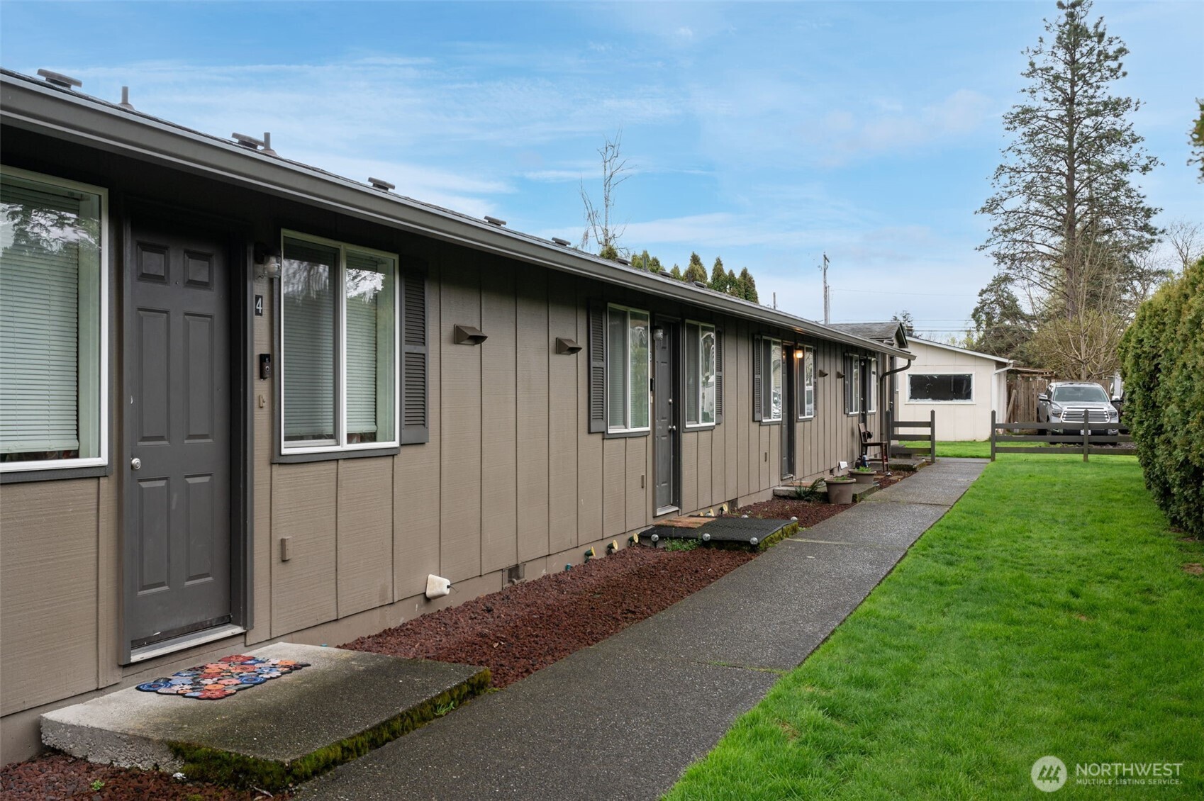 218 3rd Avenue Southwest Pacific, WA 98047 - Photo 3 of 16 a backyard of a house with lots of green space