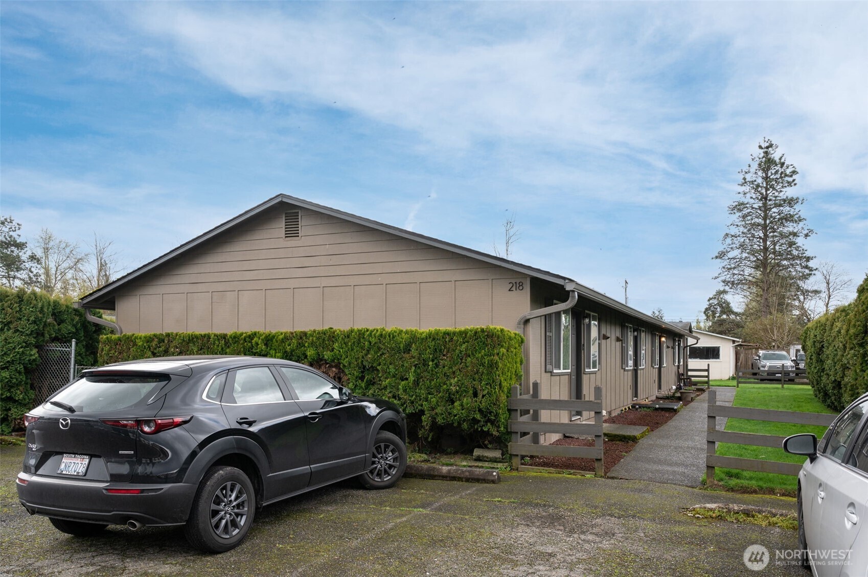 218 3rd Avenue Southwest Pacific, WA 98047 - Photo 4 of 16 a car parked in front of a house
