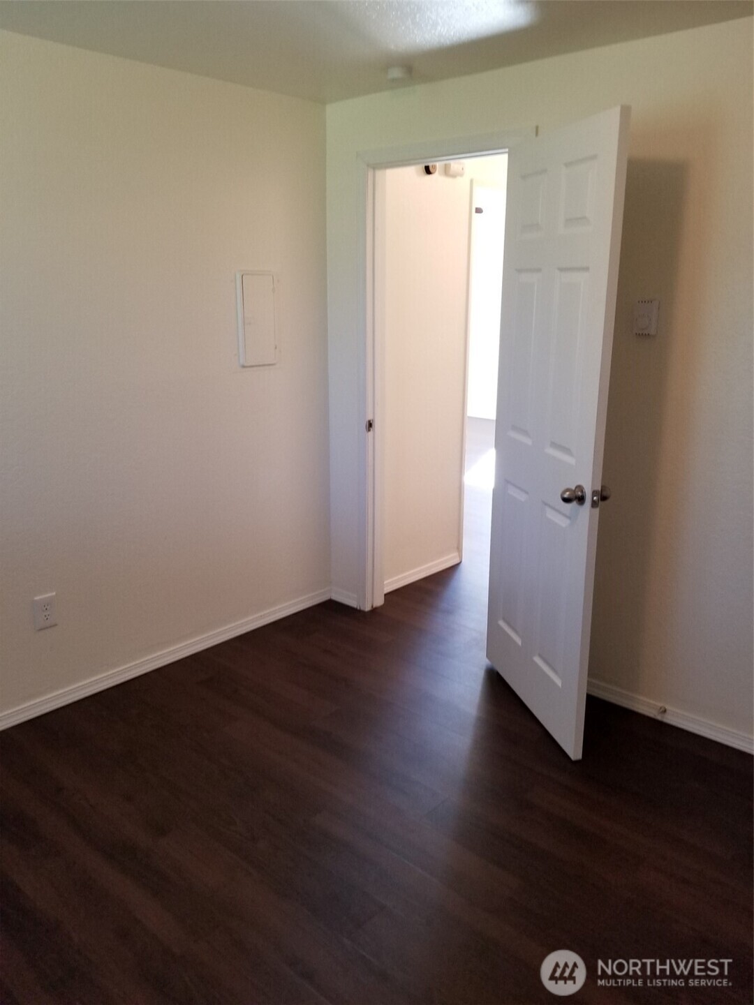 218 3rd Avenue Southwest Pacific, WA 98047 - Photo 8 of 16 an empty room with wooden floor and sink