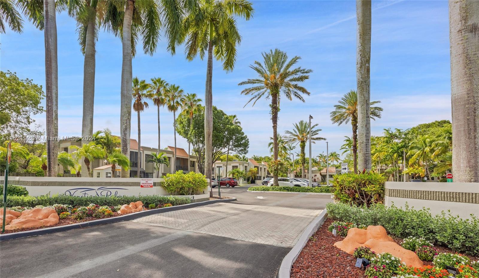 7927 Southwest 104th Street, Unit 108E Miami, FL 33156 - Photo 13 of 17 a view of palm trees and a palm tree