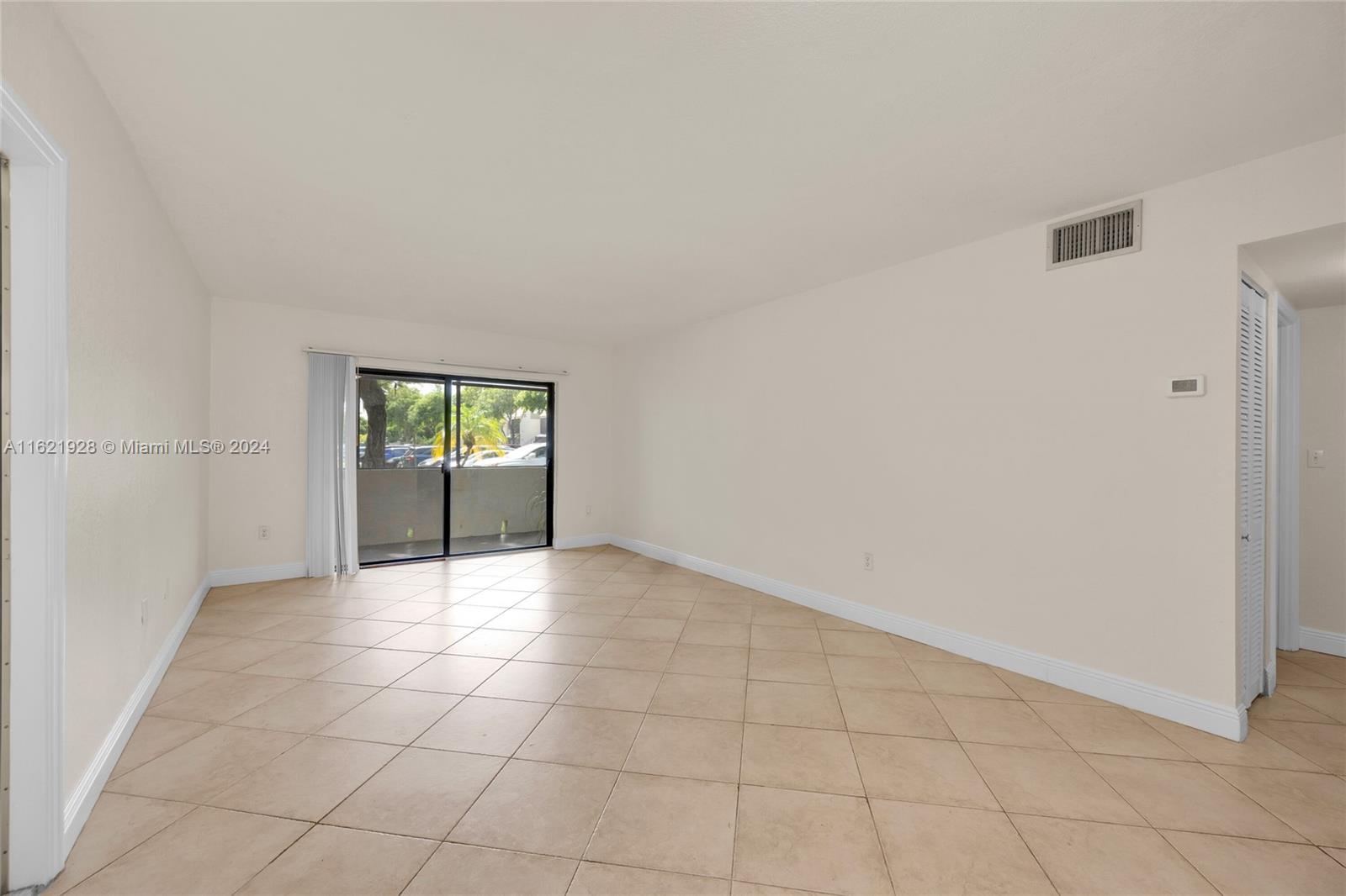 7927 Southwest 104th Street, Unit 108E Miami, FL 33156 - Photo 14 of 17 a view of an empty room and window