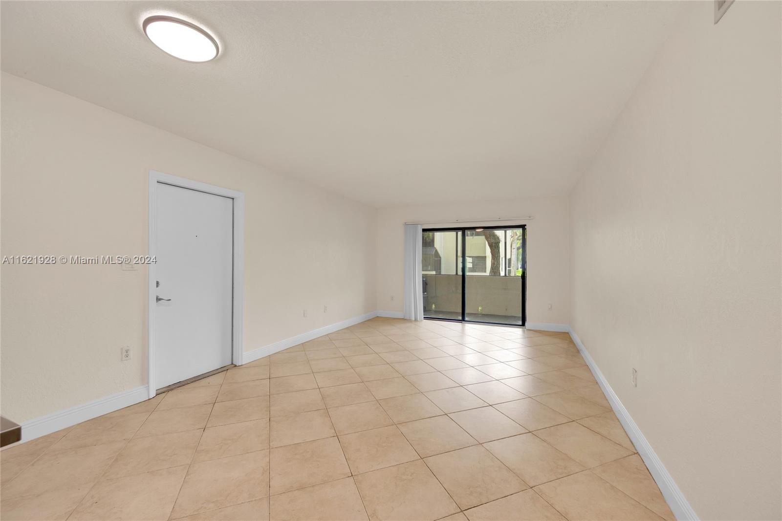 7927 Southwest 104th Street, Unit 108E Miami, FL 33156 - Photo 5 of 17 an empty room with windows and closet