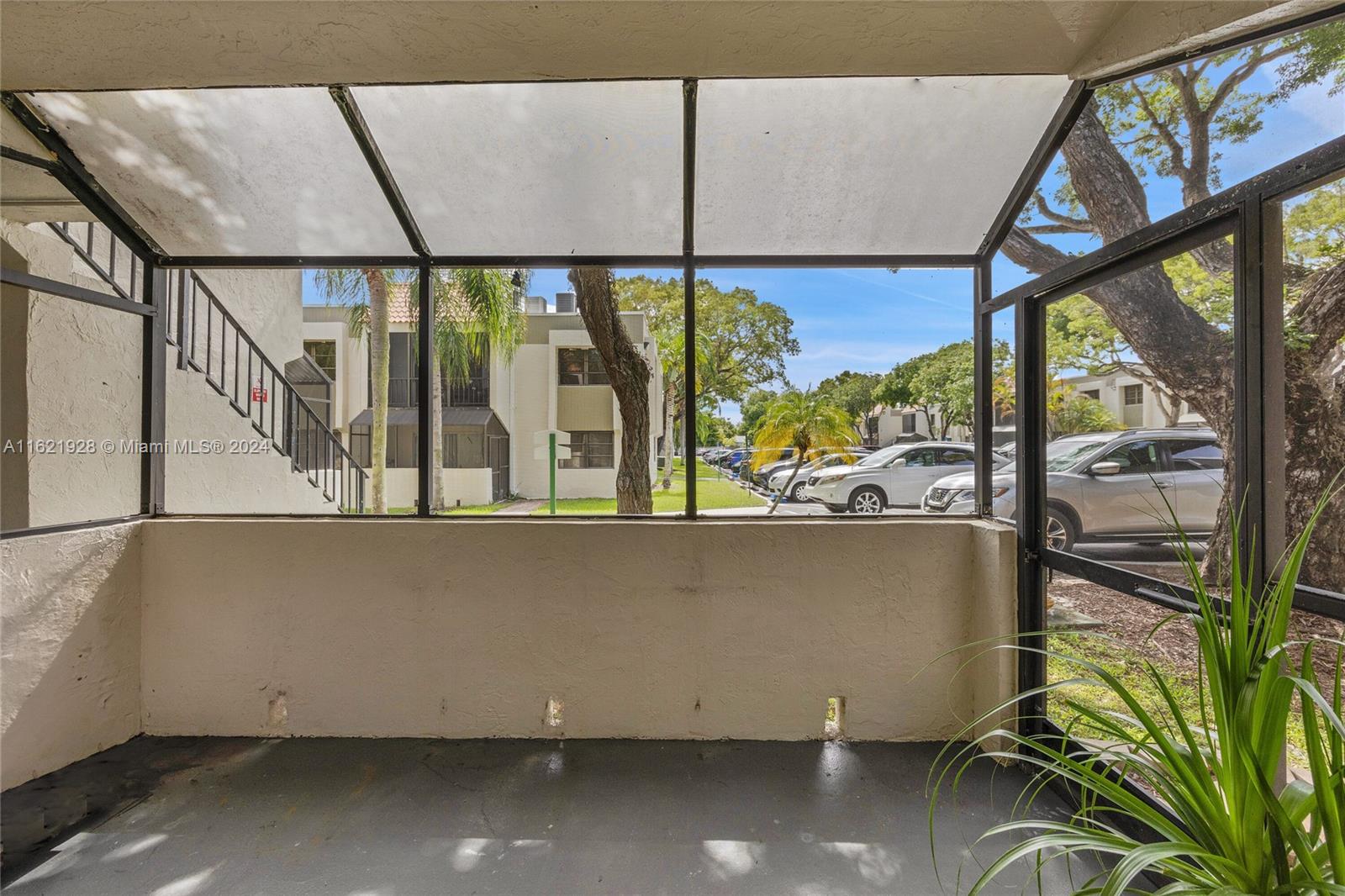 7927 Southwest 104th Street, Unit 108E Miami, FL 33156 - Photo 9 of 17 a view of outdoor living space with furniture