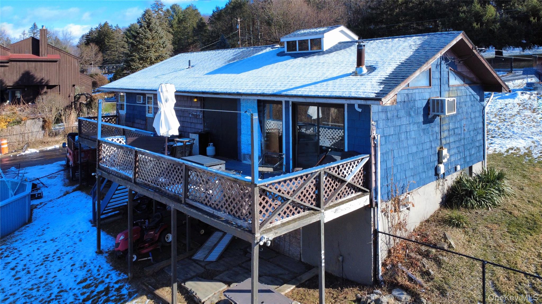 39 Brothers Road Poughquag, NY 12570 - Photo 5 of 21 a view of a house with wooden deck and furniture