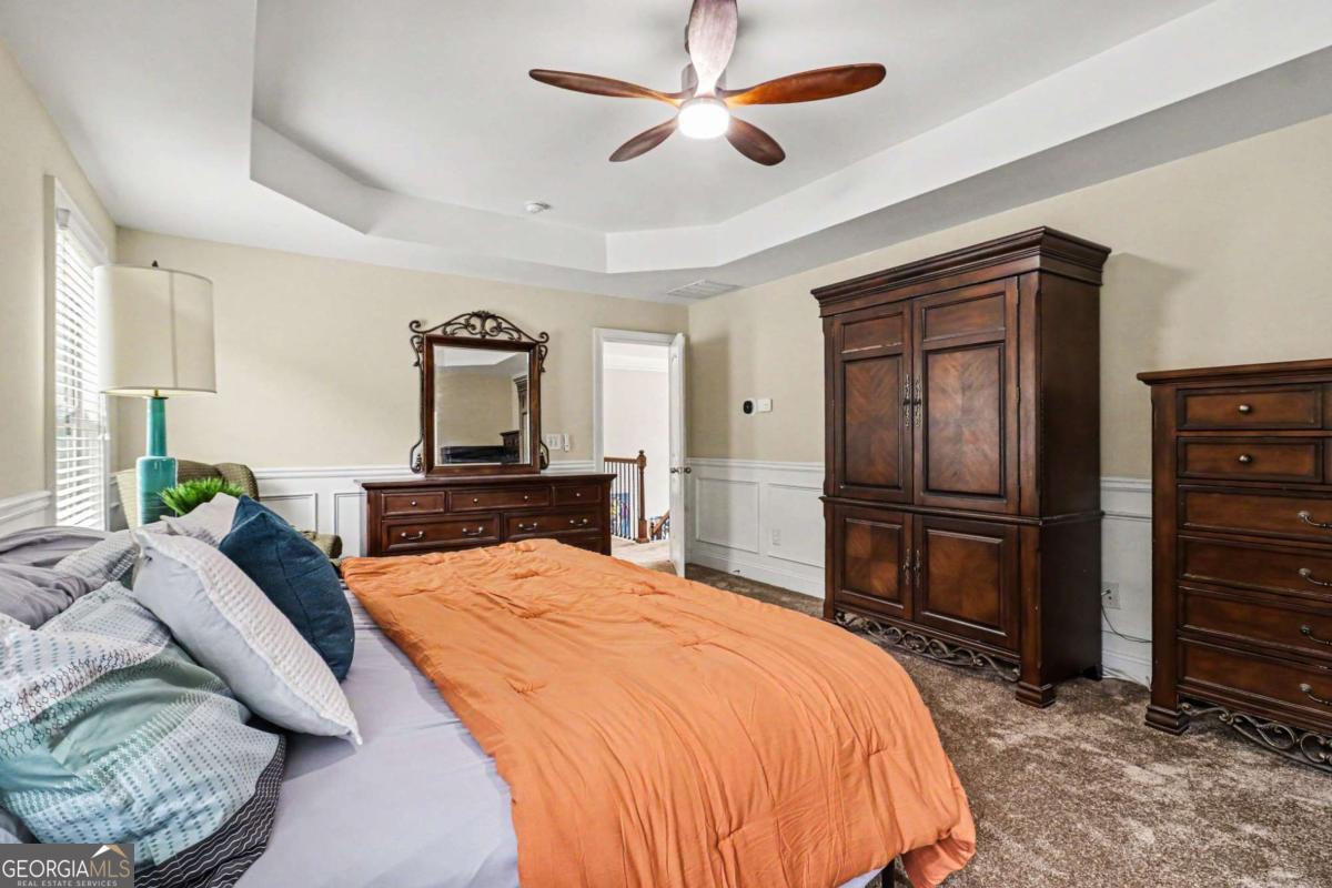 207 George Wynn Road Palmetto, GA 30268 - Photo 18 of 32 a bedroom with a bed and a dresser