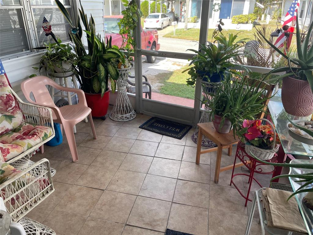 8620 Southwest 22nd Street Davie, FL 33324 - Photo 11 of 11 a backyard of a house with outdoor seating