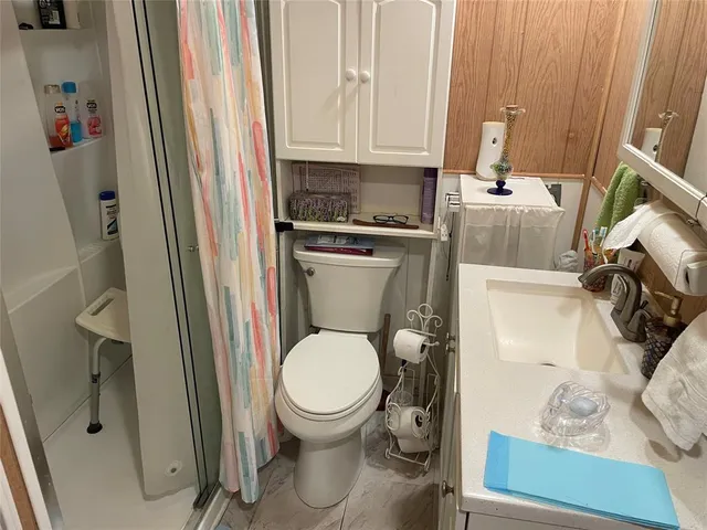 a bathroom with a toilet and a sink