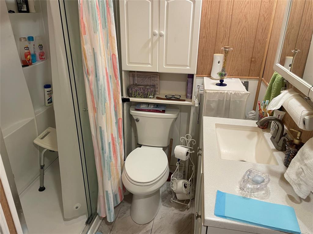 8620 Southwest 22nd Street Davie, FL 33324 - Photo 8 of 11 a bathroom with a toilet and a sink
