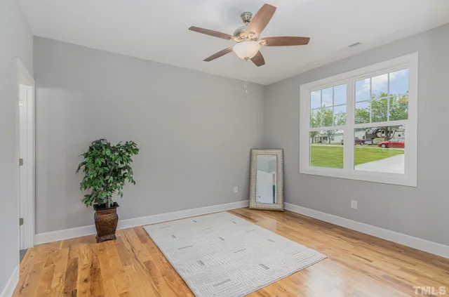 a vase of flowers sitting on a desk