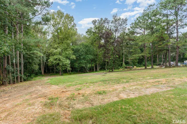 a view of outdoor space with trees all around