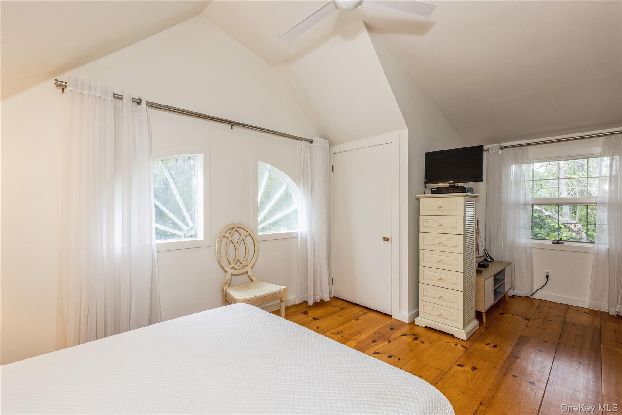 91 Sunset Beach Road Sag Harbor, NY 11963 - Photo 12 of 16 a bedroom with a bed and a window
