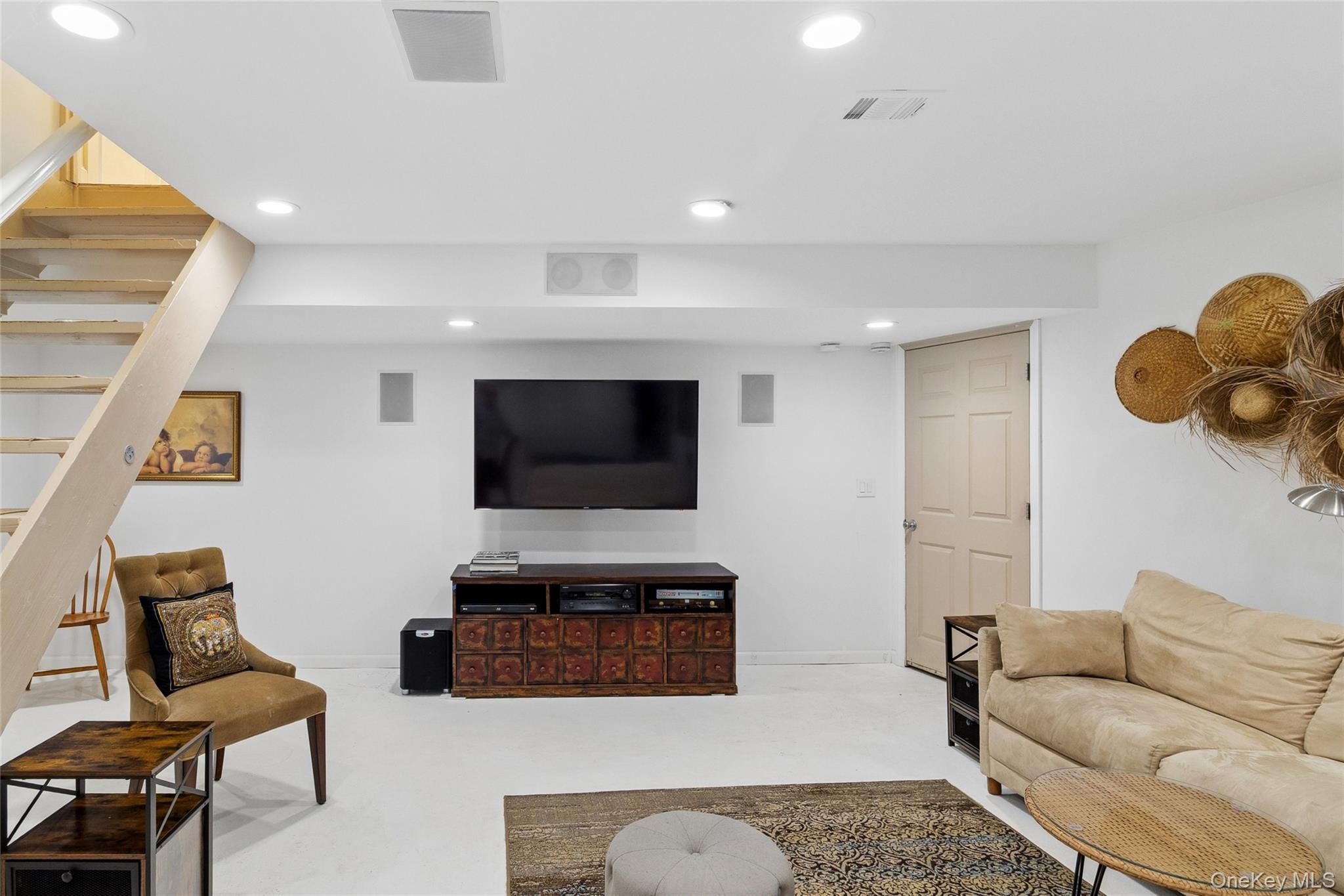 91 Sunset Beach Road Sag Harbor, NY 11963 - Photo 15 of 16 a living room with furniture and a flat screen tv