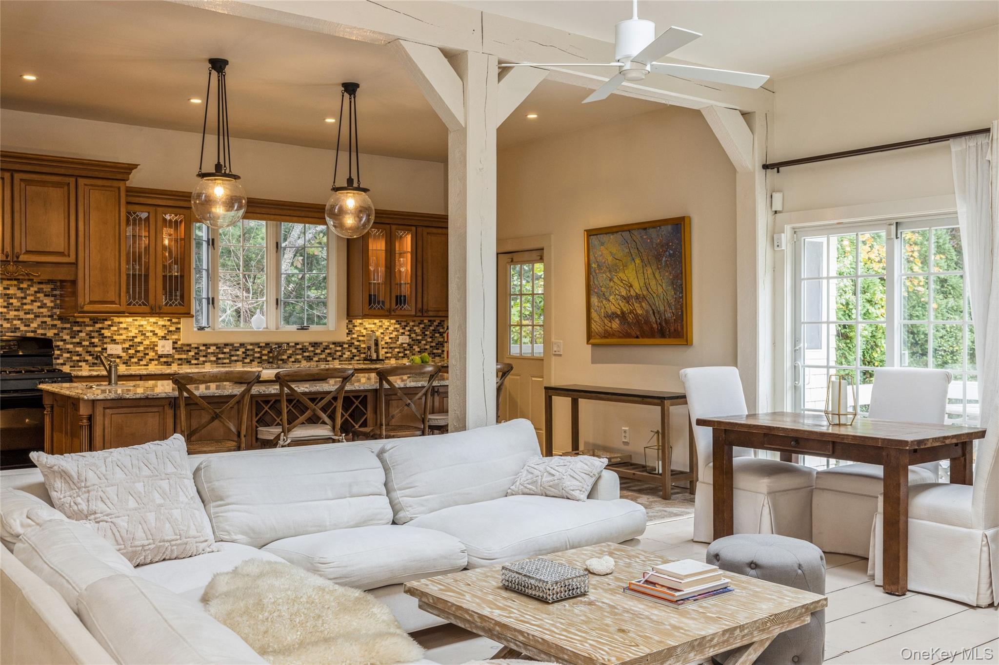 91 Sunset Beach Road Sag Harbor, NY 11963 - Photo 3 of 16 a living room with furniture and a large window