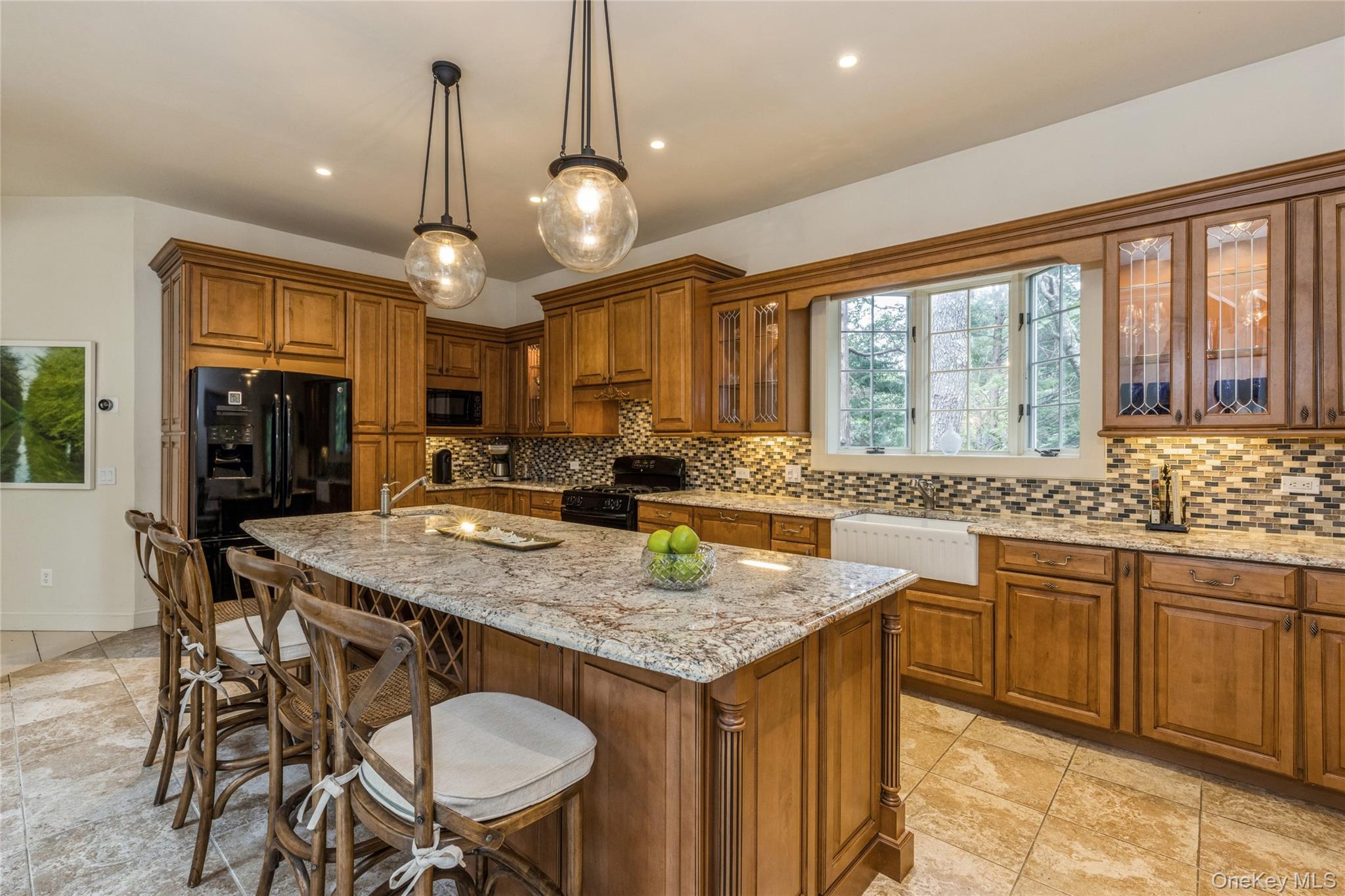 91 Sunset Beach Road Sag Harbor, NY 11963 - Photo 4 of 16 a kitchen with center island table and chairs
