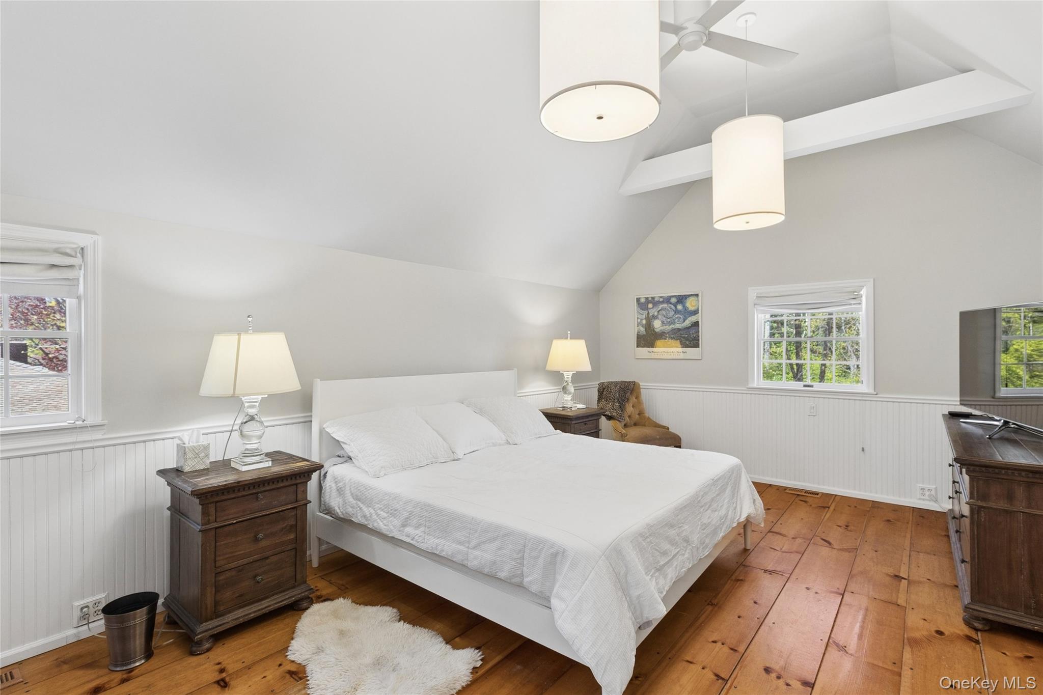 91 Sunset Beach Road Sag Harbor, NY 11963 - Photo 5 of 16 a bedroom with a bed and a table