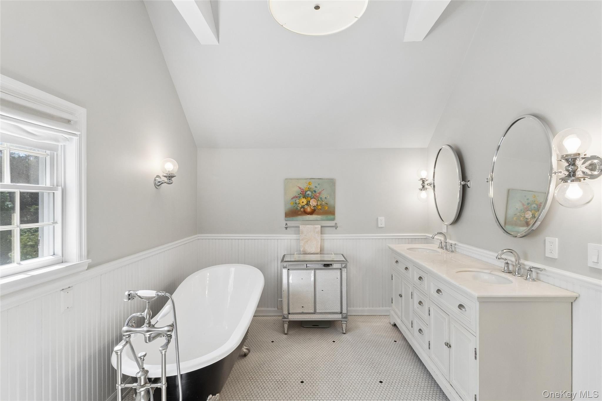 91 Sunset Beach Road Sag Harbor, NY 11963 - Photo 7 of 16 a bathroom with a double vanity sink and a mirror