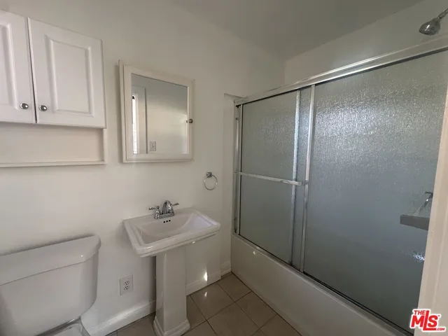 a bathroom with a sink toilet and vanity