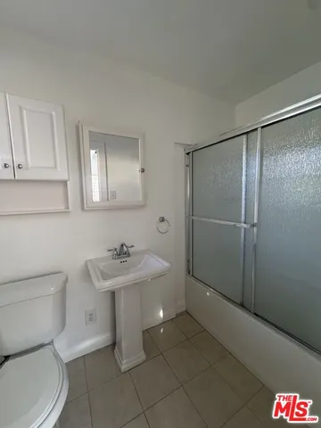 a bathroom with a sink toilet and vanity