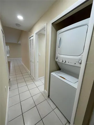 a view of washer and dryer with wooden floor