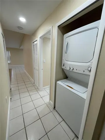 a view of washer and dryer with wooden floor