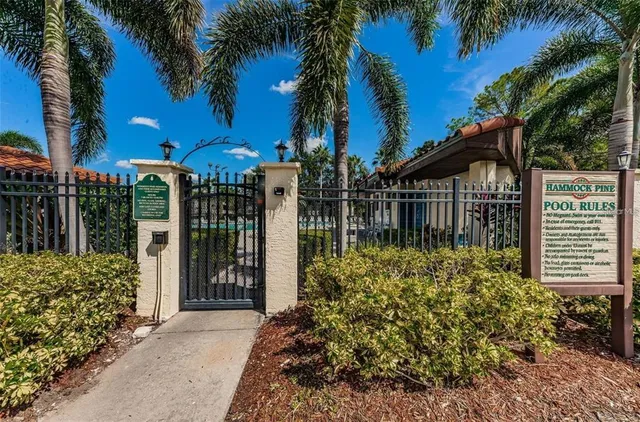 a view of a pathway of a house with a garden
