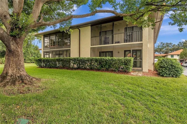 a view of balcony door and two couches