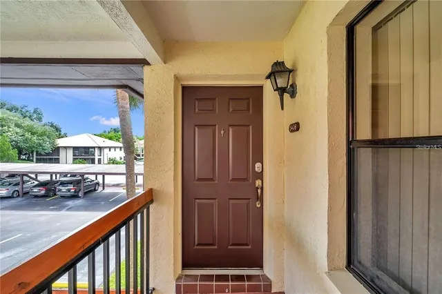 an aerial view of residential houses with outdoor space and lake view