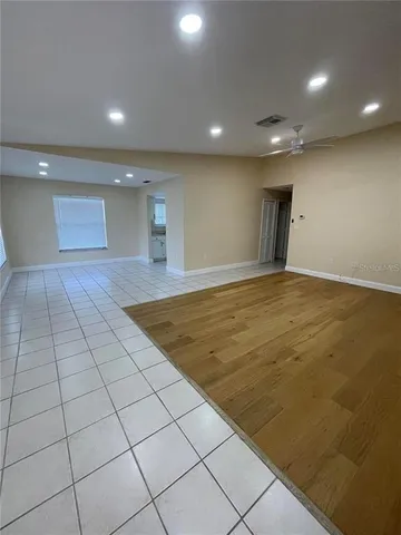 an empty room with wooden floor