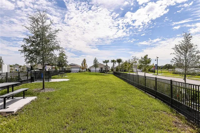 a view of swimming pool with a yard and sitting area
