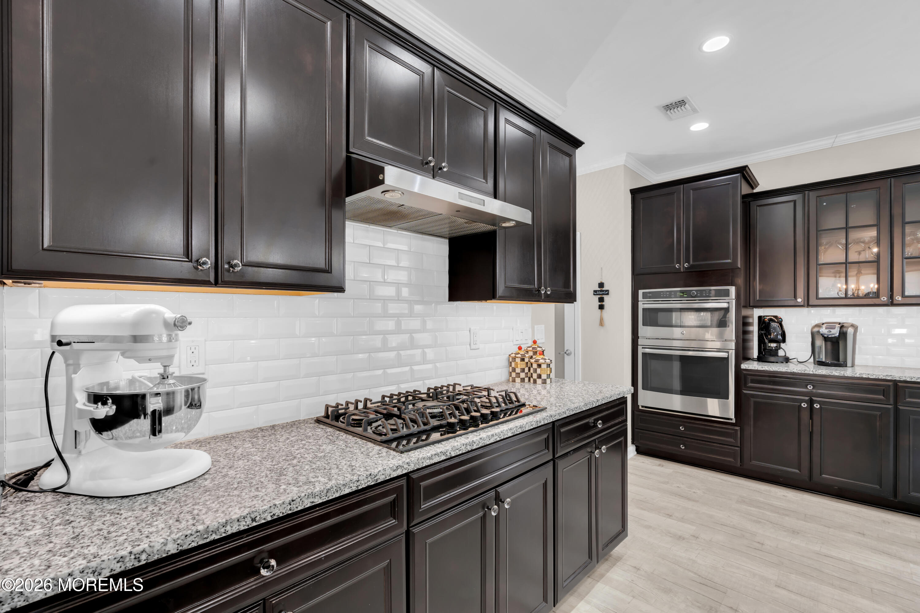 30 Harvest Ridge Road Howell, NJ 07731 - Photo 13 of 38 a kitchen with granite countertop stainless steel appliances and wooden cabinets