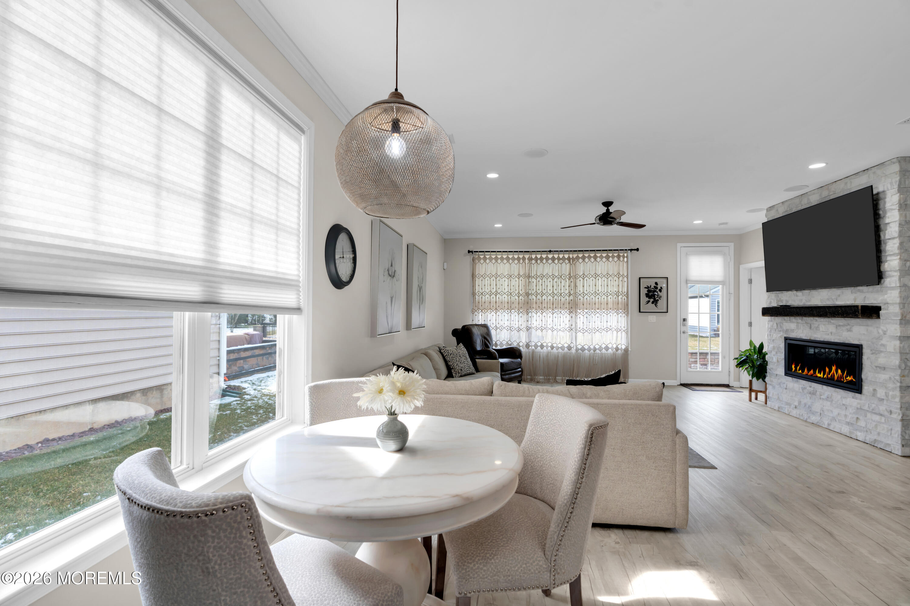 30 Harvest Ridge Road Howell, NJ 07731 - Photo 17 of 38 a living room with fireplace furniture and a large window