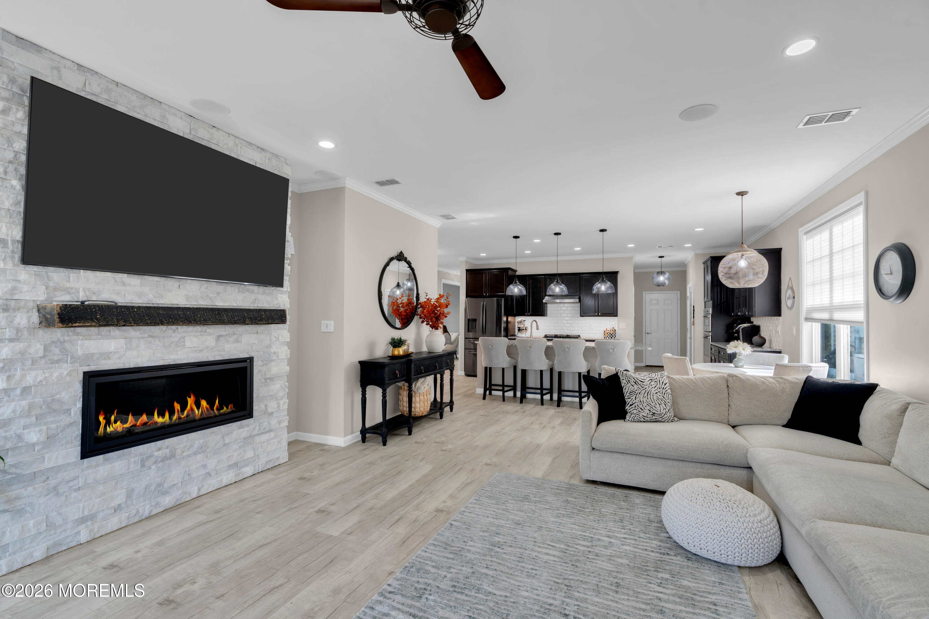 30 Harvest Ridge Road Howell, NJ 07731 - Photo 19 of 38 a living room with furniture and a fireplace