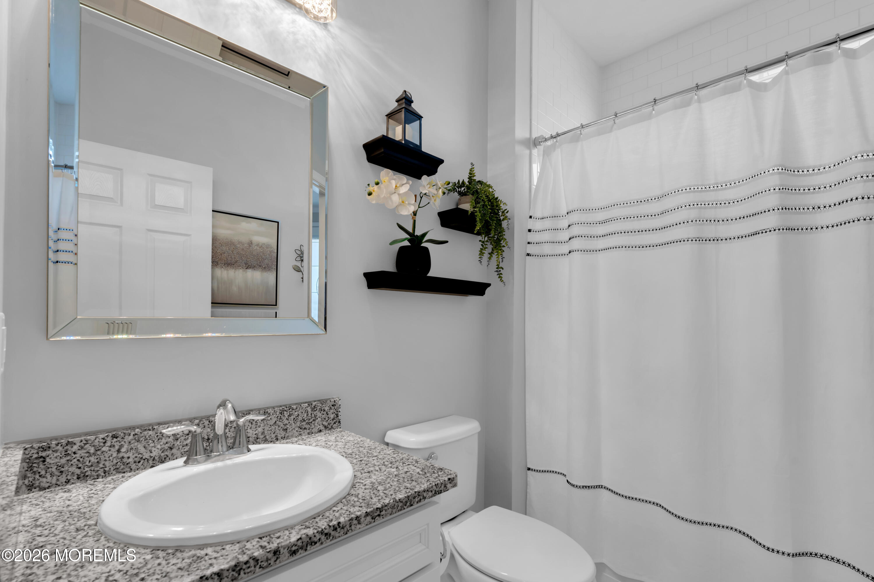 30 Harvest Ridge Road Howell, NJ 07731 - Photo 28 of 38 a bathroom with a sink toilet and mirror