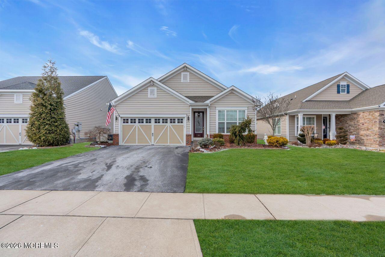 30 Harvest Ridge Road Howell, NJ 07731 - Photo 36 of 38 a front view of a house with a yard
