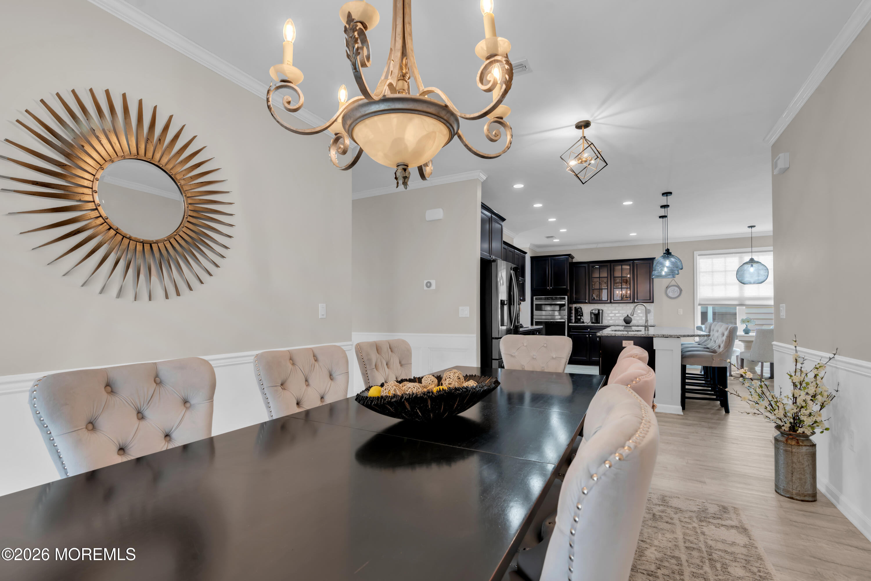 30 Harvest Ridge Road Howell, NJ 07731 - Photo 8 of 38 a living room with furniture and a chandelier