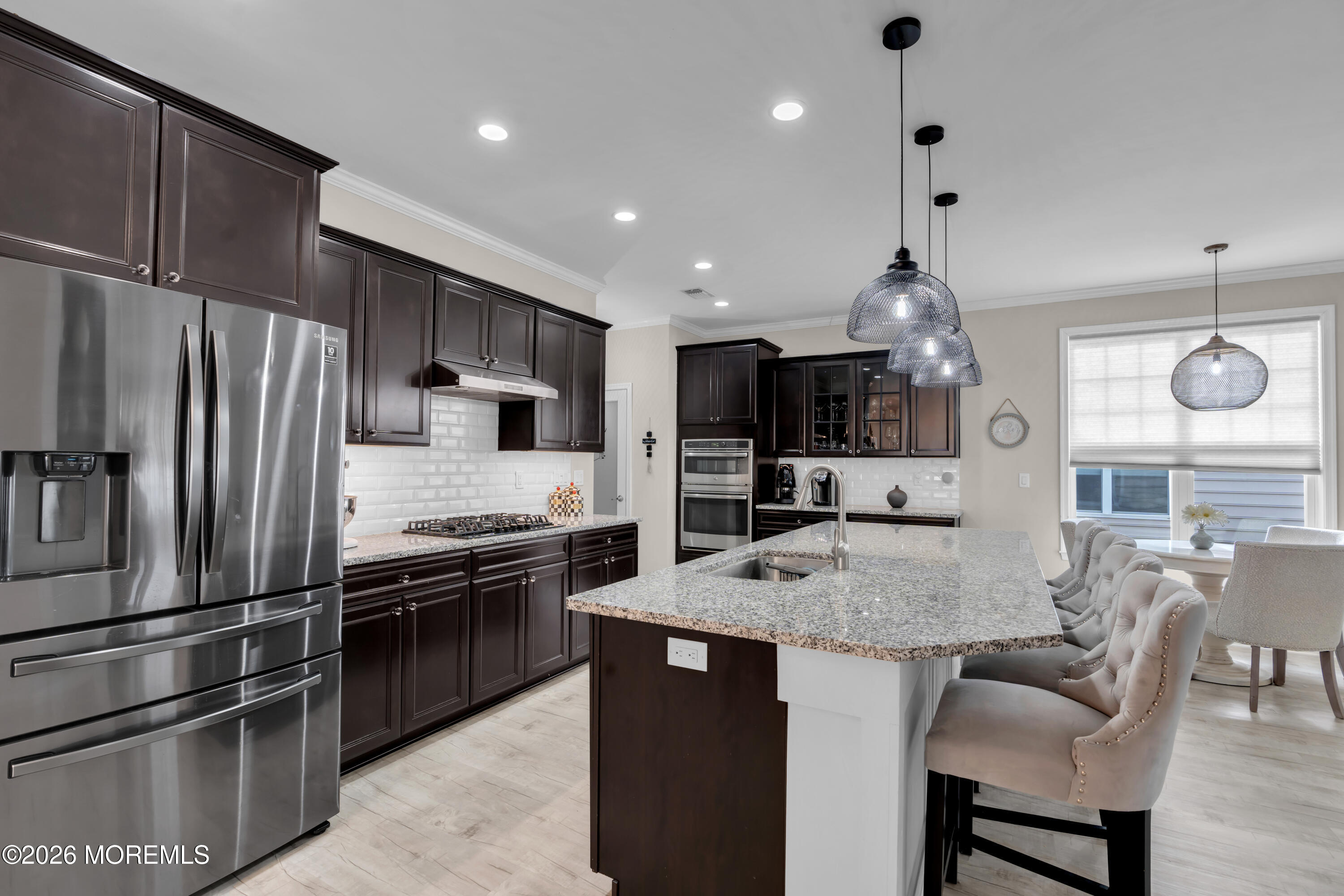 30 Harvest Ridge Road Howell, NJ 07731 - Photo 9 of 38 a kitchen with stainless steel appliances granite countertop a sink refrigerator and cabinets