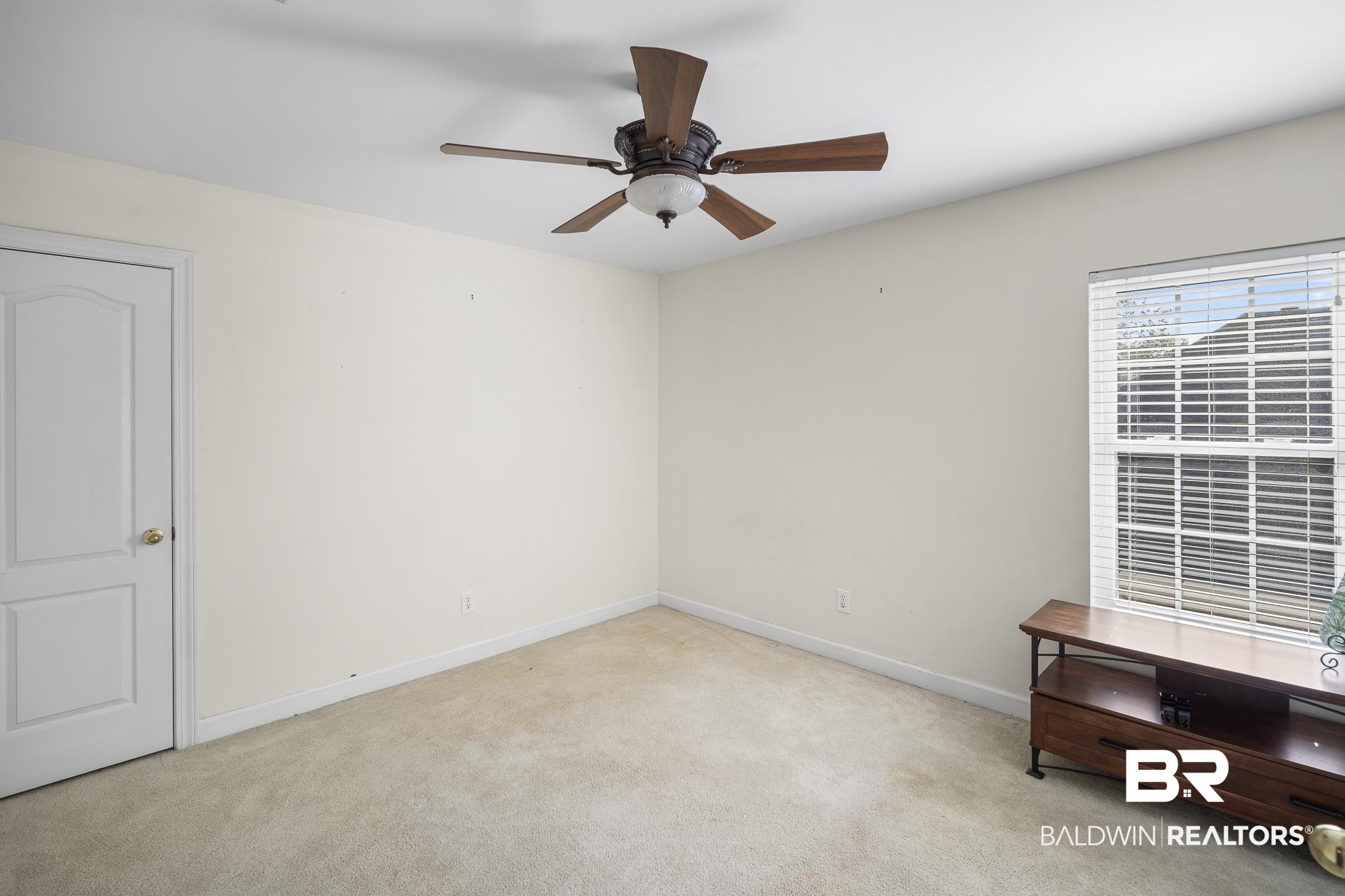 19876 Hunters Loop Fairhope, AL 36532 - Photo 29 of 40 Carpeted spare room featuring baseboards and ceiling fan