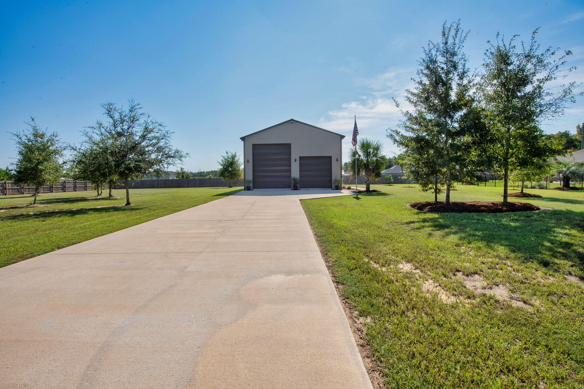 5392 South A Jones Road Milton, FL 32583 - Photo 14 of 55 a view of a house with a big yard and large trees