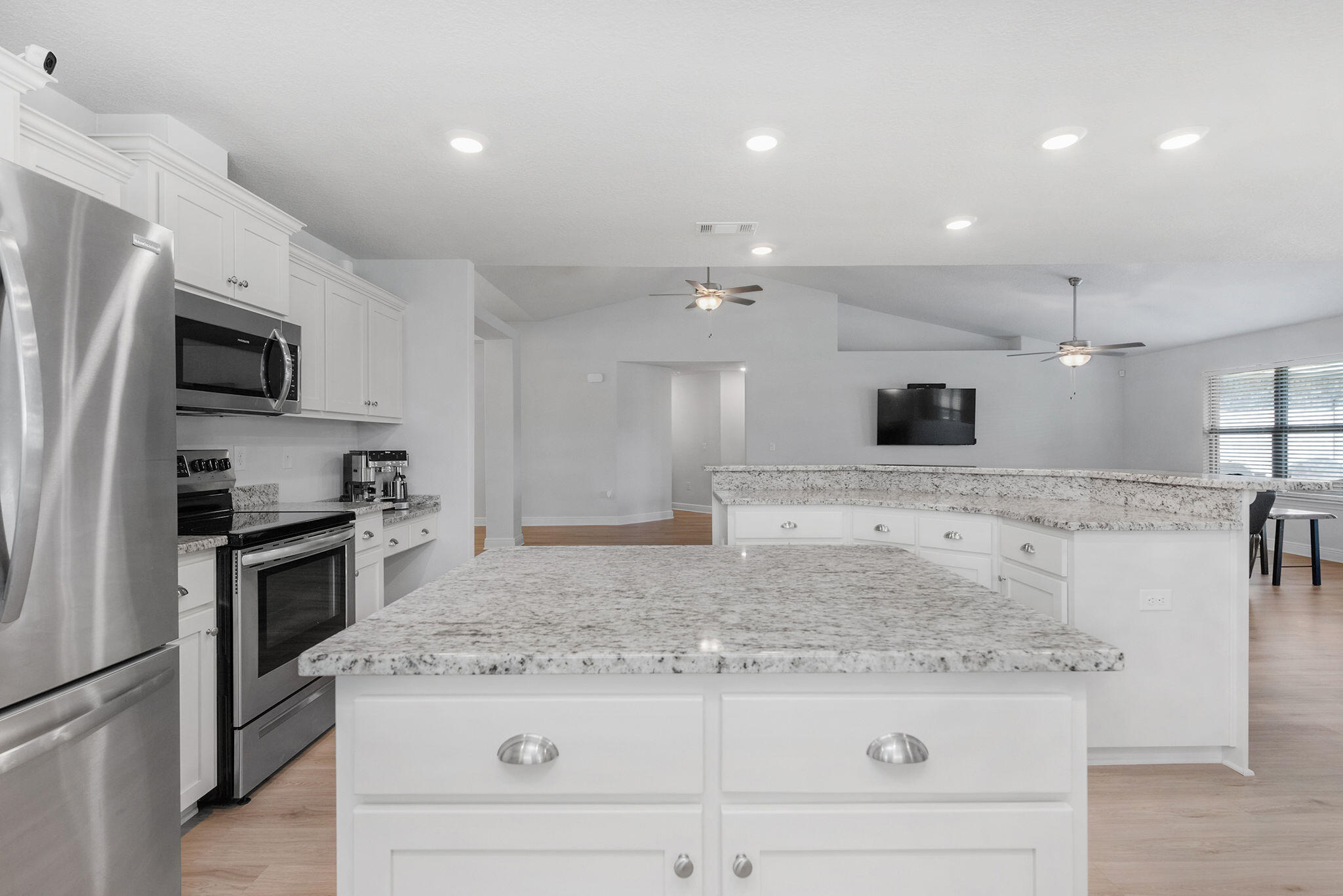 5392 South A Jones Road Milton, FL 32583 - Photo 25 of 55 a kitchen with kitchen island granite countertop a sink and stainless steel appliances