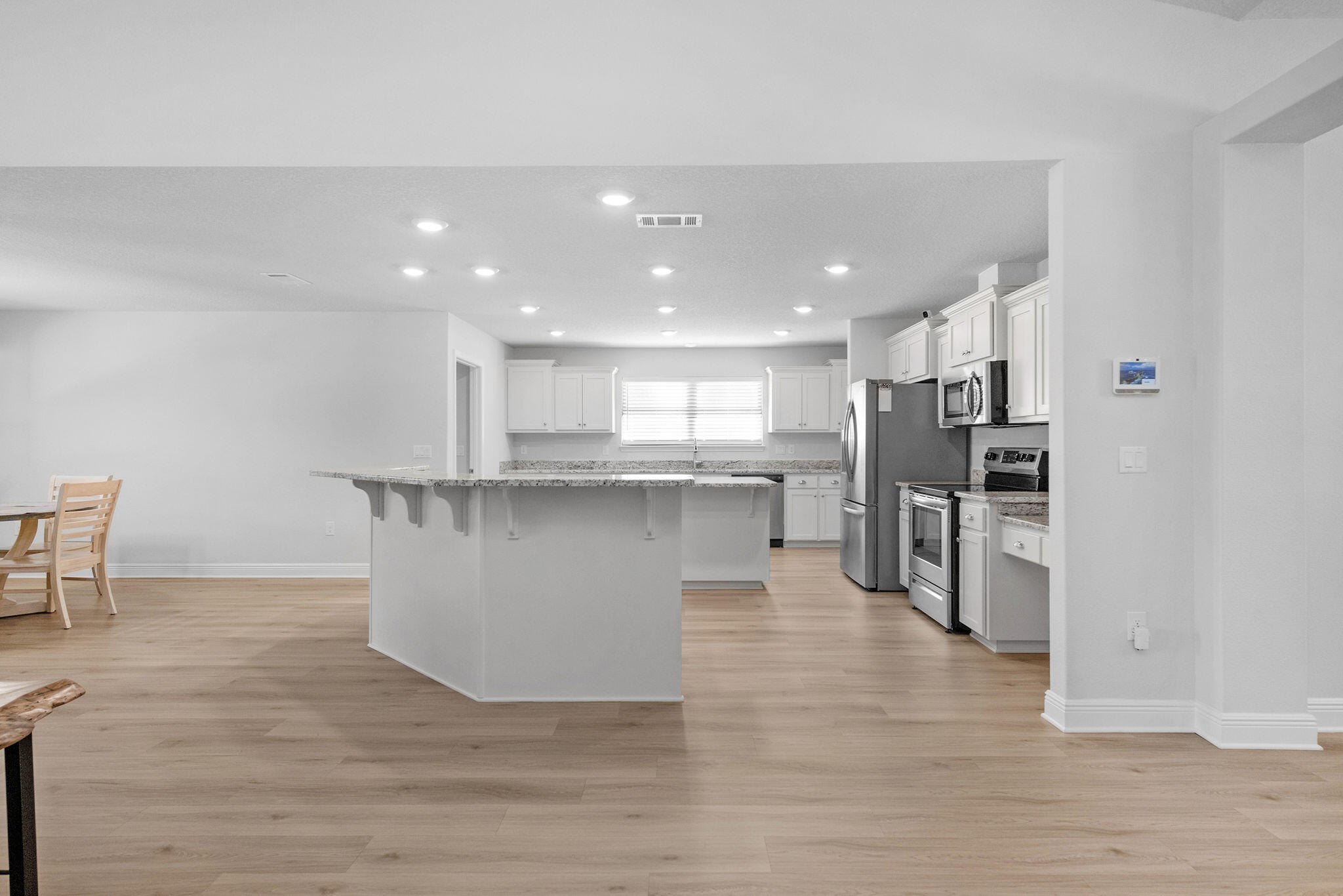 5392 South A Jones Road Milton, FL 32583 - Photo 29 of 55 a view of kitchen with stainless steel appliances granite countertop a stove top oven a sink and a refrigerator