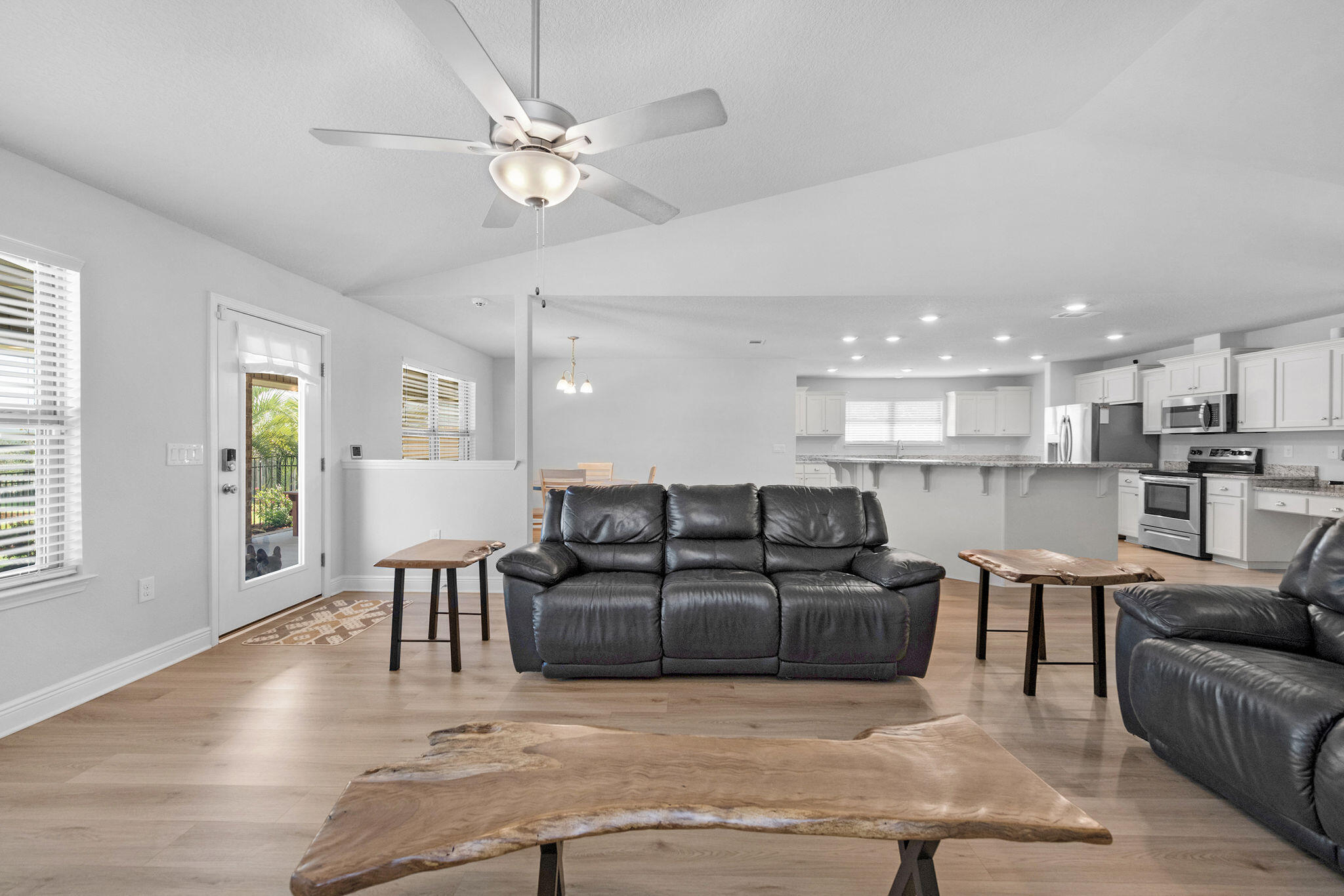 5392 South A Jones Road Milton, FL 32583 - Photo 32 of 55 a living room with furniture with kitchen view and a window