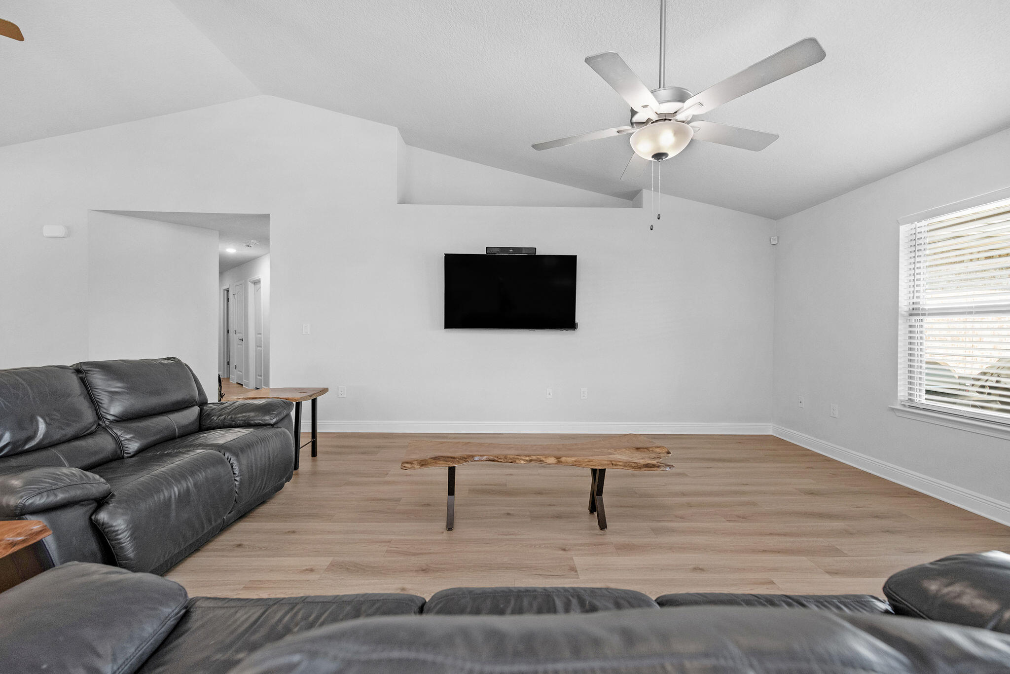 5392 South A Jones Road Milton, FL 32583 - Photo 36 of 55 a living room with furniture and a flat screen tv