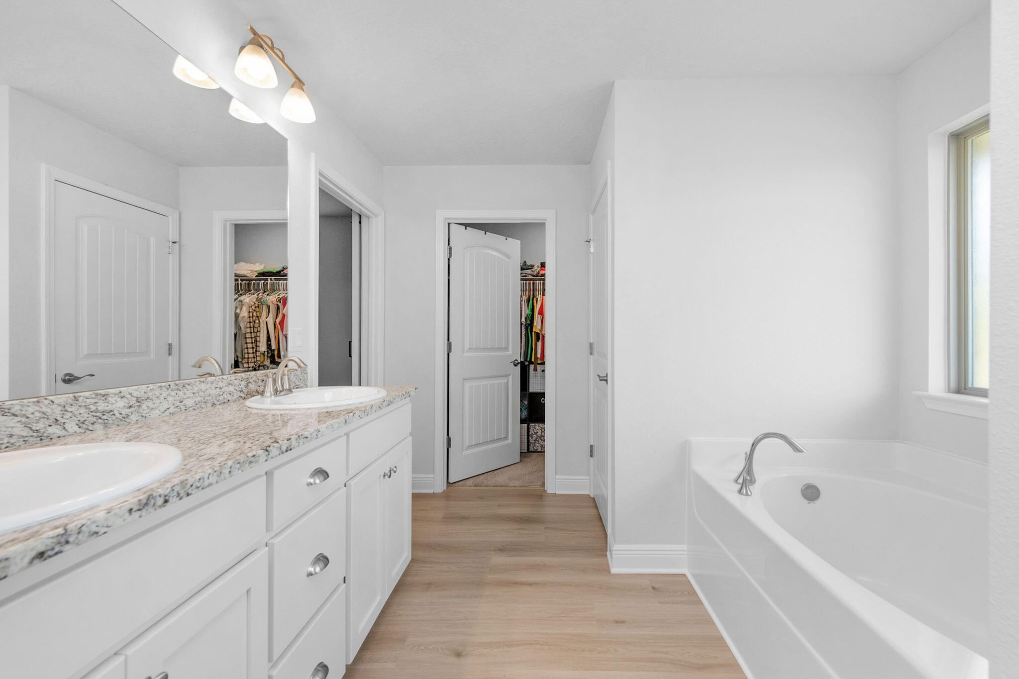 5392 South A Jones Road Milton, FL 32583 - Photo 42 of 55 a bathroom with a granite countertop sink a bathtub and a mirror