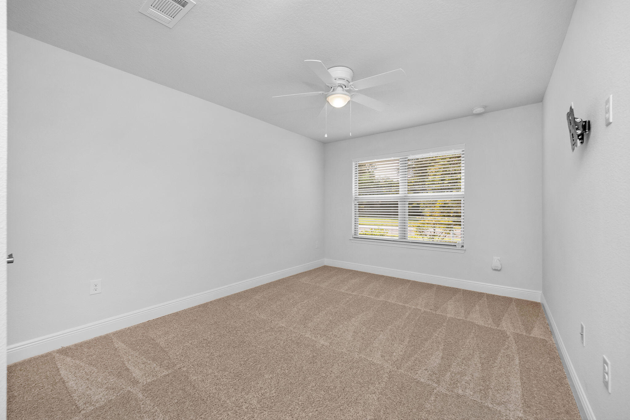 5392 South A Jones Road Milton, FL 32583 - Photo 46 of 55 an empty room with windows and chandelier fan