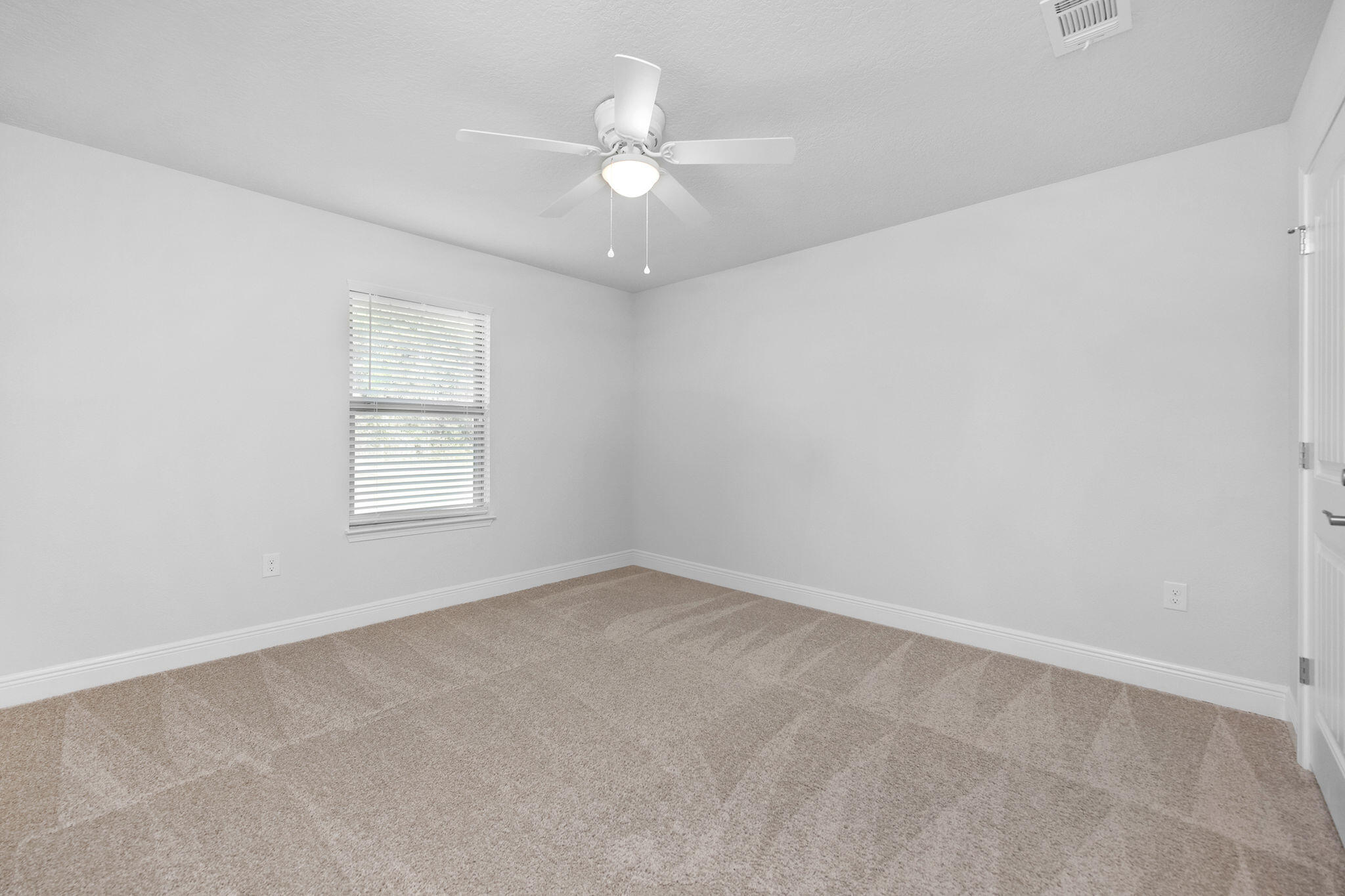 5392 South A Jones Road Milton, FL 32583 - Photo 51 of 55 an empty room with a window and a fan