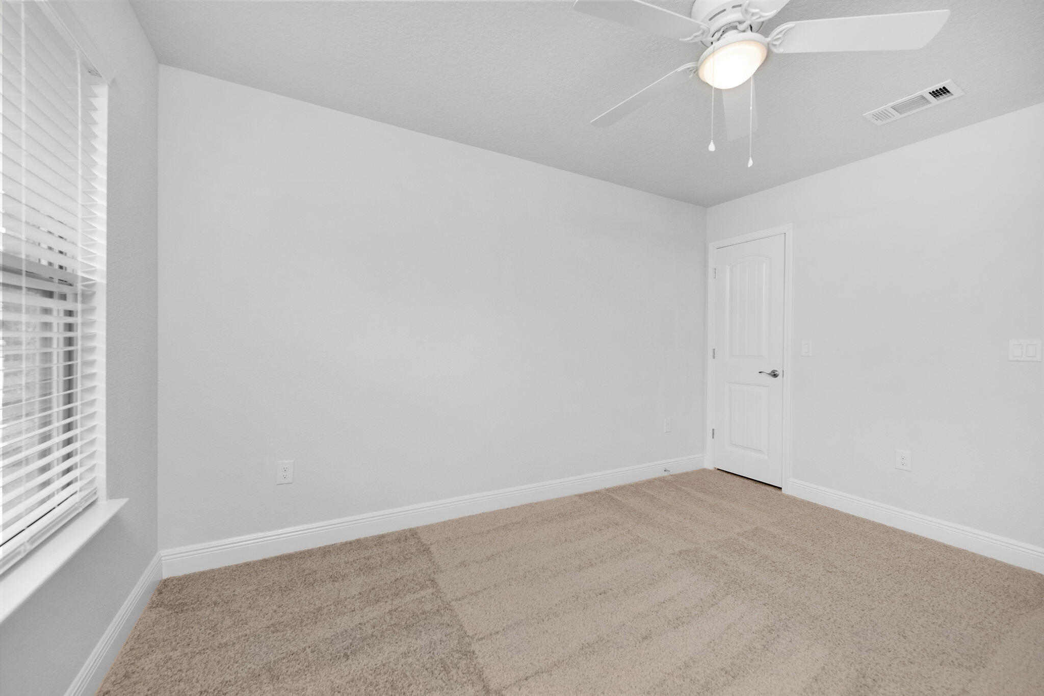 5392 South A Jones Road Milton, FL 32583 - Photo 52 of 55 an empty room with a window and a fan