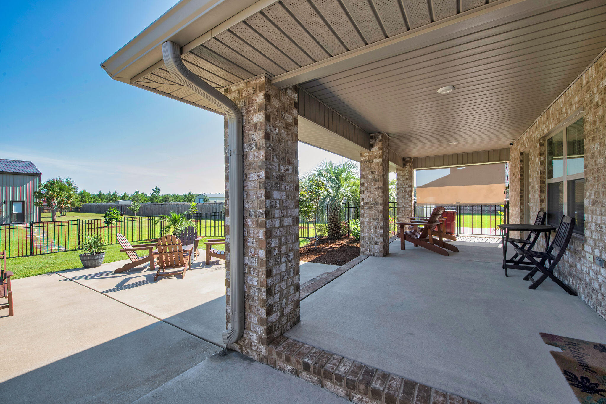 5392 South A Jones Road Milton, FL 32583 - Photo 7 of 55 a view of a patio with a table chairs and a large tree