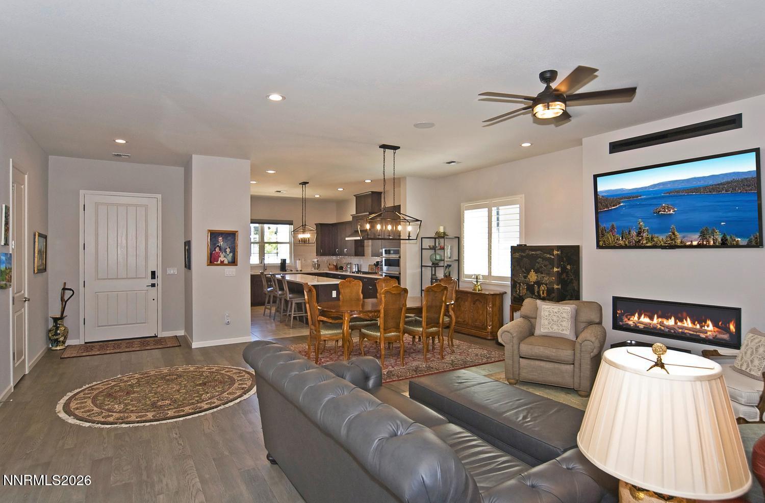 2332 Hammer Falls Drive Reno, NV 89521 - Photo 12 of 57 a living room with furniture and a chandelier