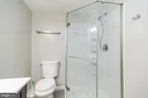 a bedroom with a bed and a flat tv screen